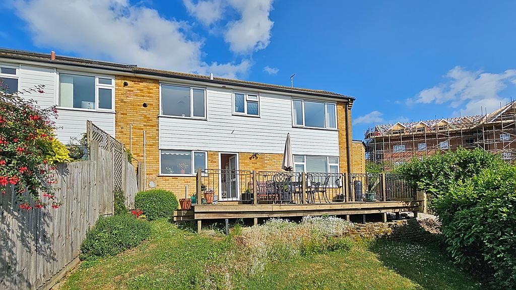 Property photo 1 of 17 A House With A Deck And A Garden.