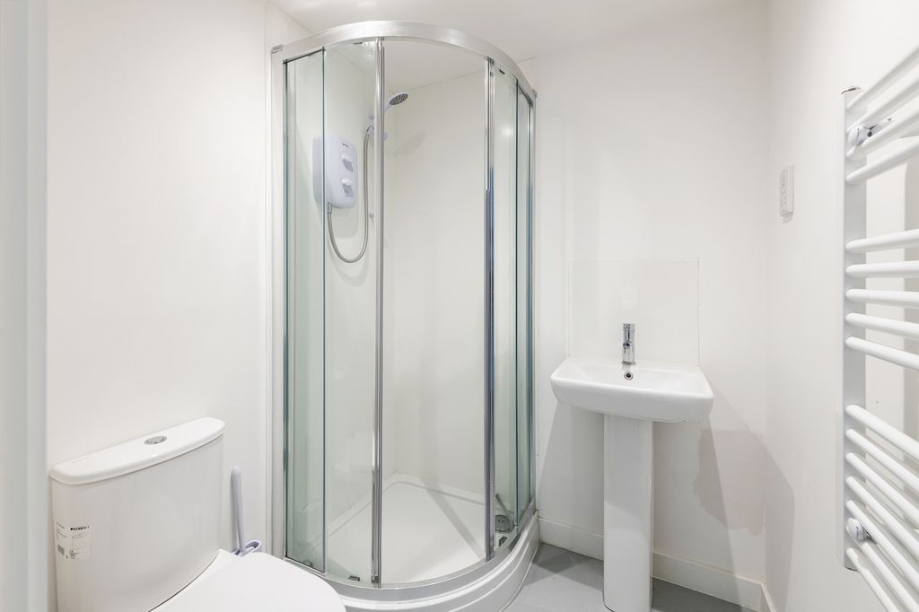 Property photo 2 of 5 A Modern And Clean Bathroom Featuring A Stylish Sh...
