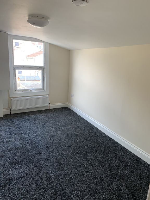 Property photo 3 of 6 A Well-Lit Room With A Clean Carpet And A Window, ...