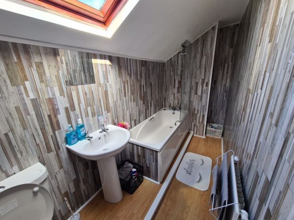 Property photo 3 of 9 A Clean And Brightly Lit Bathroom Featuring A Bath...