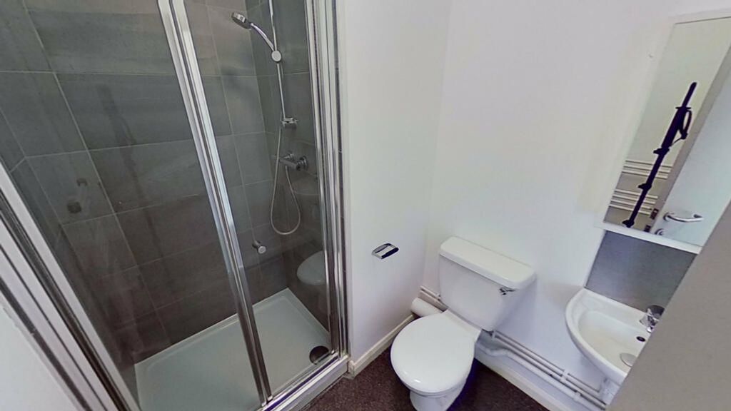 Property photo 3 of 3 A Modern Bathroom Featuring A Sleek Shower, Stylis...