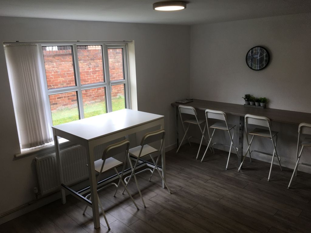Property photo 3 of 13 A Bright And Spacious Living Room Featuring Modern...