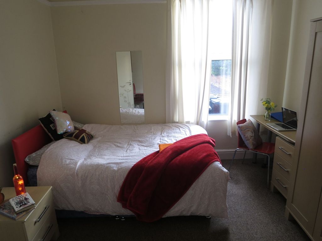 Property photo 2 of 15 Bright And Inviting Bedroom Featuring A Cozy Bed W...