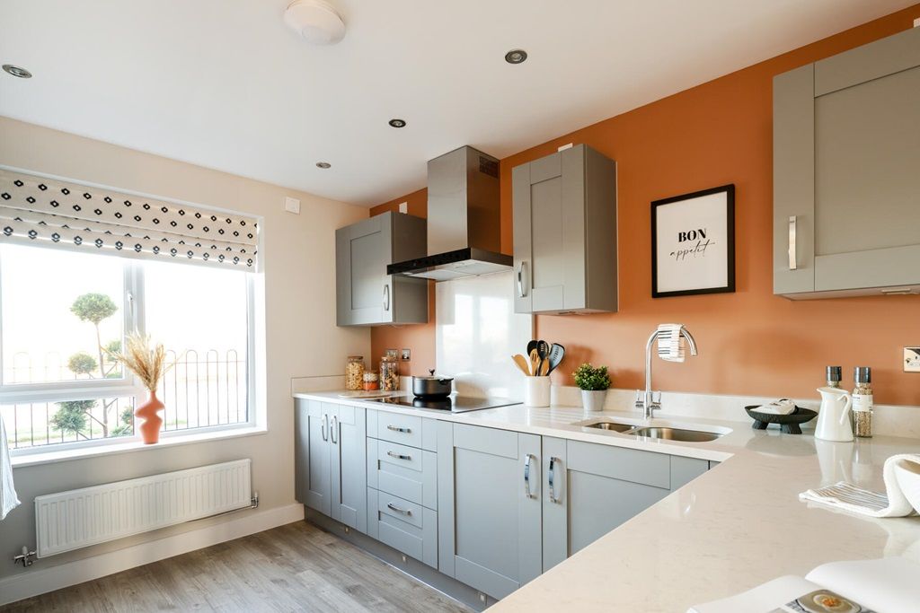 Property photo 2 of 11 The Bright And Airy Kitchen Is At The Front Of The Home