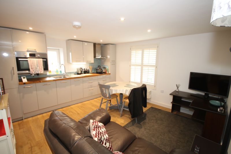 Property photo 2 of 8 Kitchen/Dining/Living Space