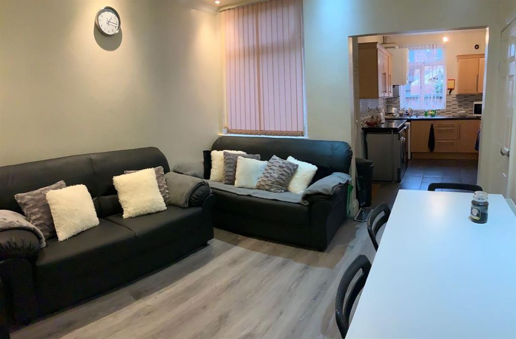 Property photo 2 of 9 Modern And Spacious Living Room Featuring Two Larg...