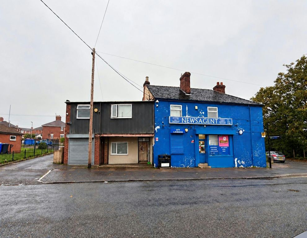 Property photo 1 of 7 Rainy Blue Newsagent Rowhouse.Jpg