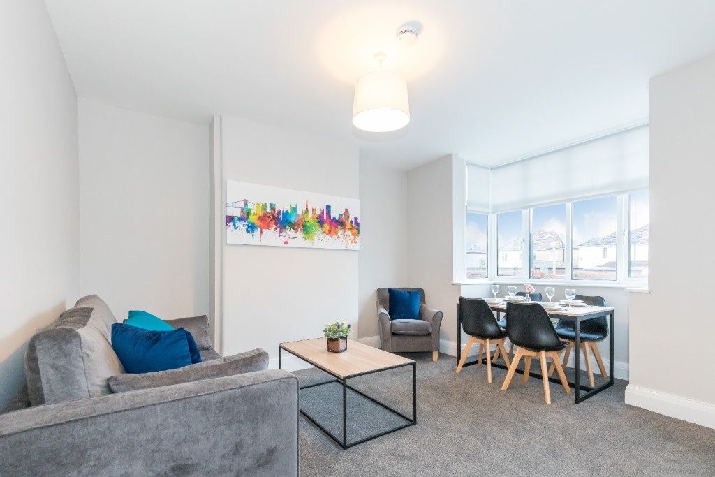 Property photo 3 of 10 A Bright And Modern Living Room Featuring A Comfor...