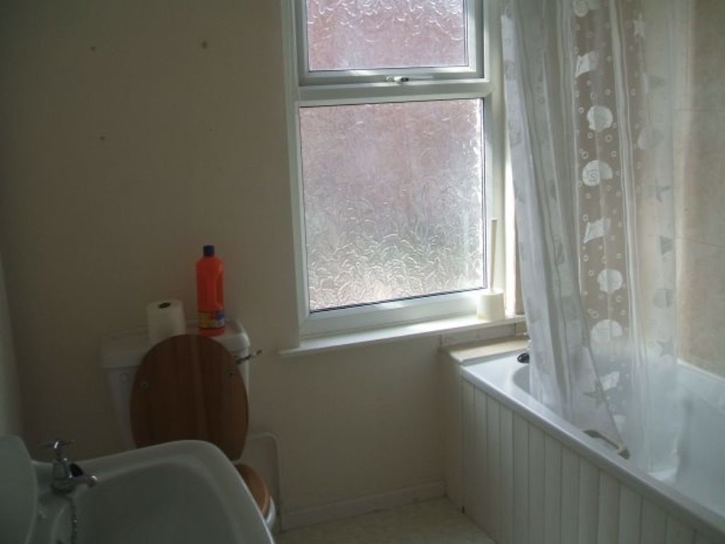 Property photo 3 of 4 Bright Bathroom With A Bathtub, Shower Curtain And...