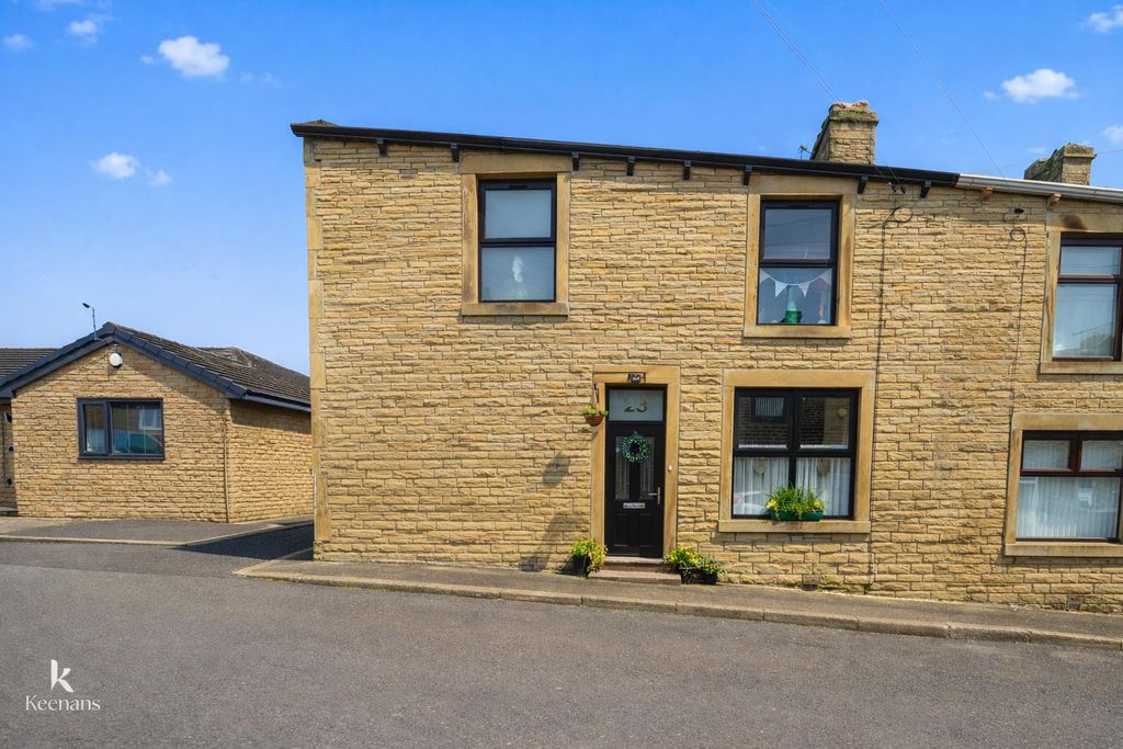 Property photo 1 of 19 Suburban Terraced Houses Under Bright Sky.Png