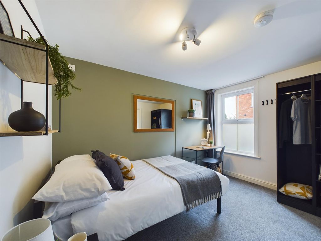 Property photo 3 of 11 A Bright And Welcoming Bedroom Featuring A Comfort...