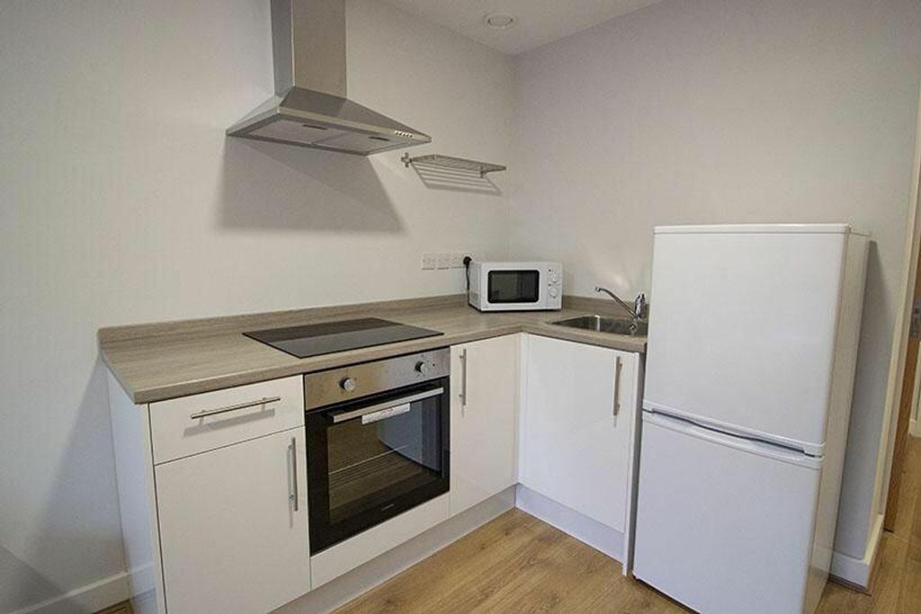 Property photo 2 of 3 This Modern Kitchen Features Sleek Cabinetry, A St...
