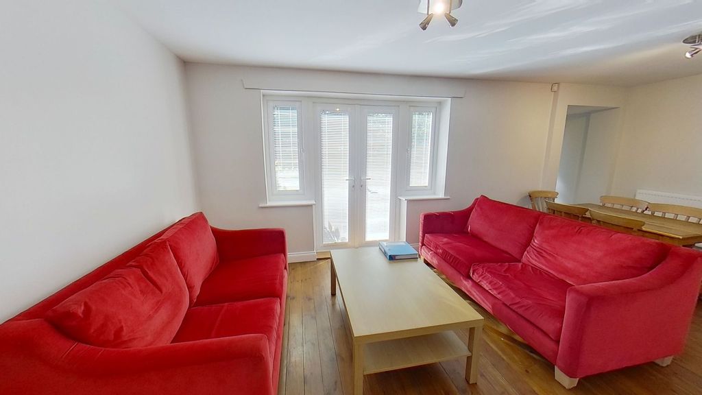 Property photo 2 of 12 Bright And Welcoming Living Room With Matching Red...