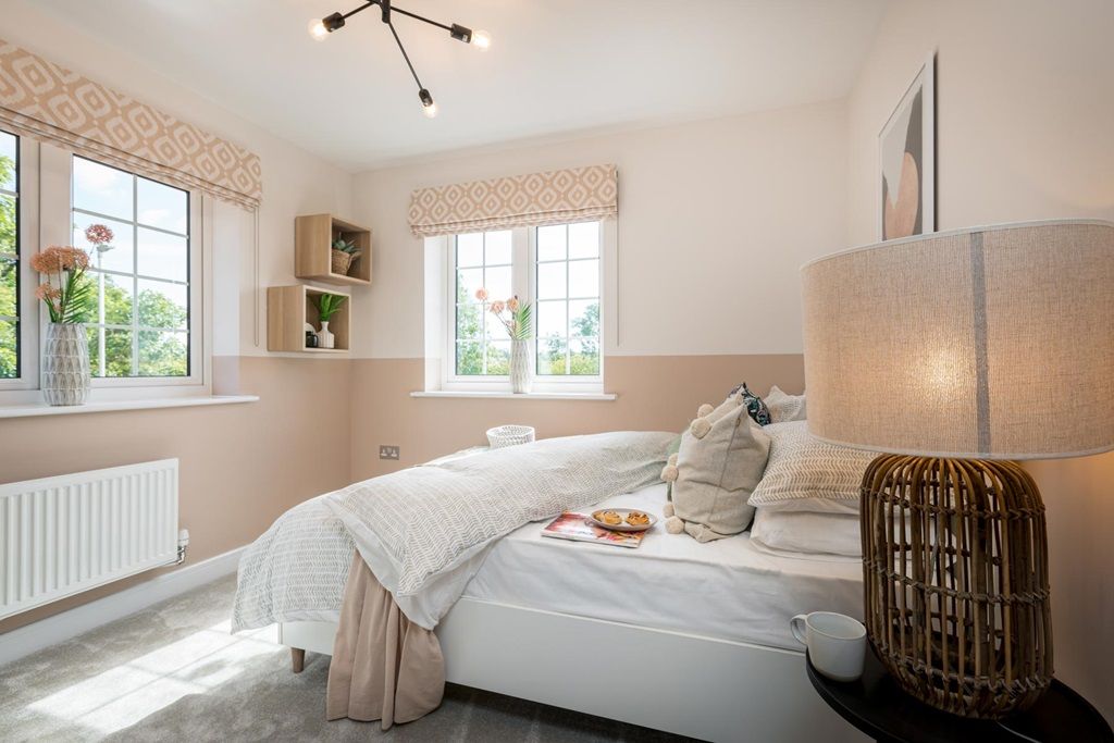 Property photo 1 of 12 Natural Light Floods This Airy Second Bedroom