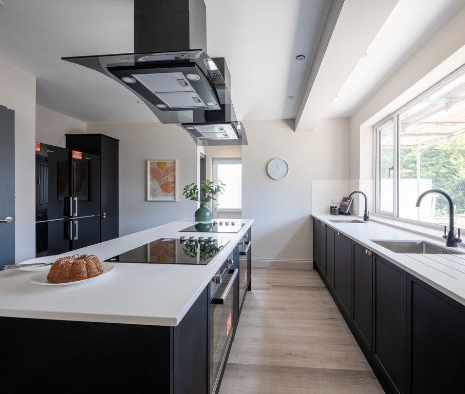Property photo 1 of 13 Ultra-Modern Kitchen With Sleek Island And Light...