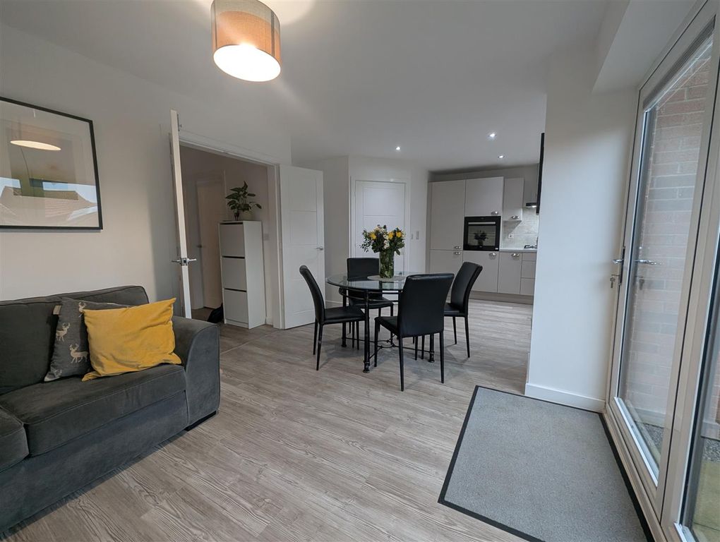 Property photo 3 of 17 Kitchen/Dining/Family Area