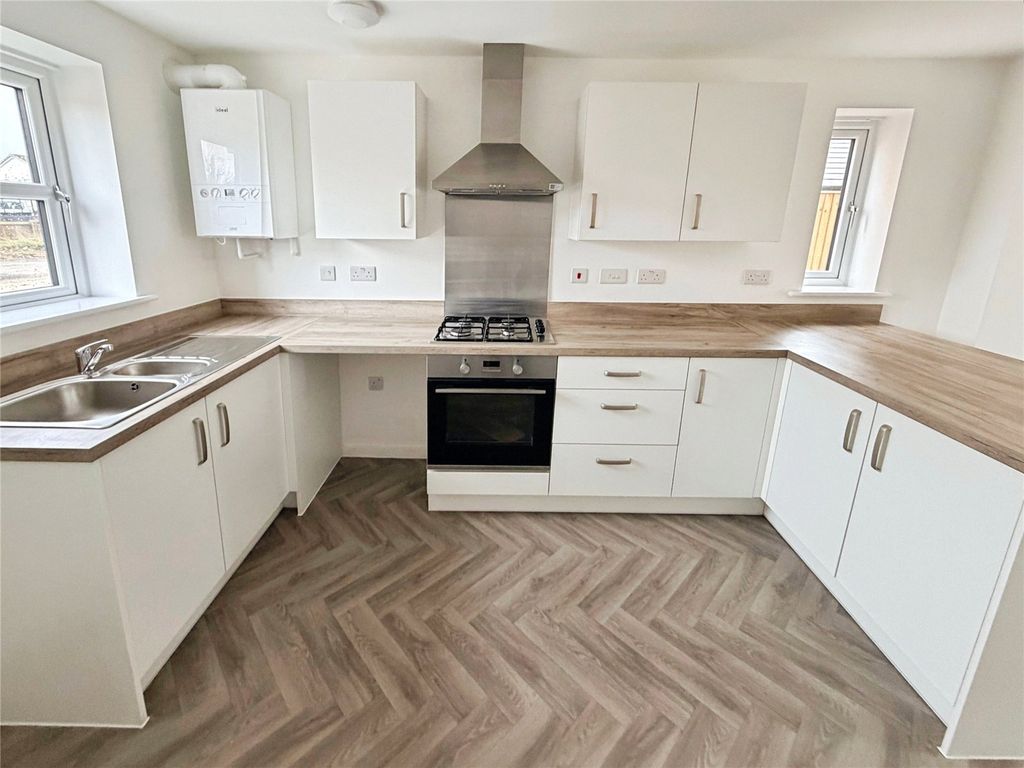 Property photo 2 of 10 Kitchen Area