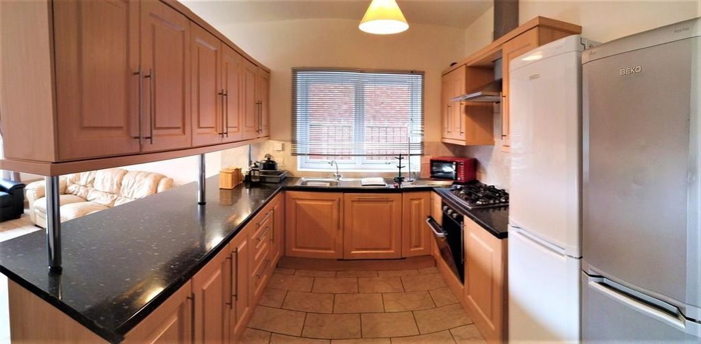 Property photo 1 of 12 A Spacious And Well-Maintained Kitchen Featuring A...