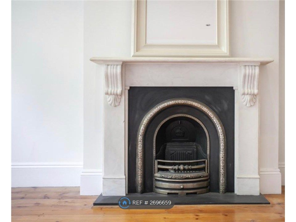 Property photo 2 of 10 Fireplace