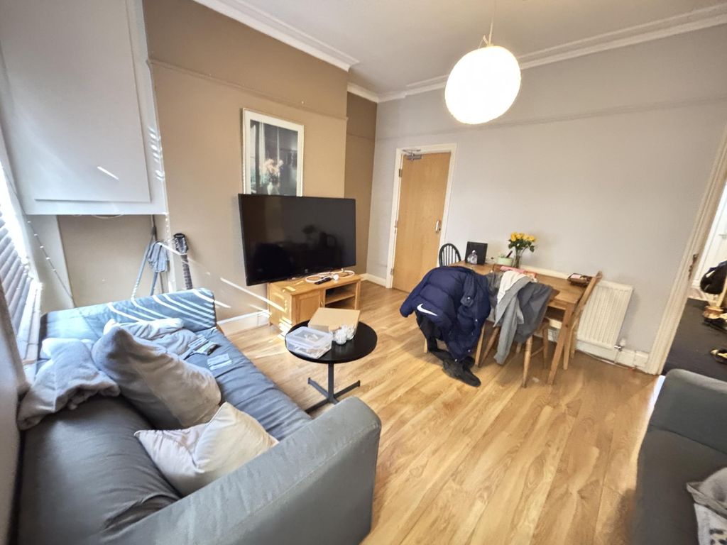 Property photo 1 of 8 A Bright And Welcoming Living Room Featuring A Com...