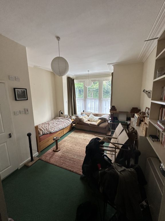 Property photo 2 of 7 A Cozy Living Room With Ample Natural Light And A ...