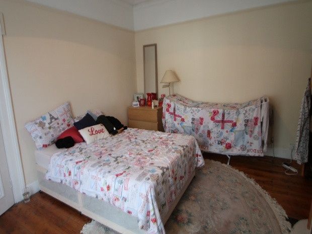 Property photo 3 of 14 A Spacious Master Bedroom Featuring A Cozy Bed, Am...