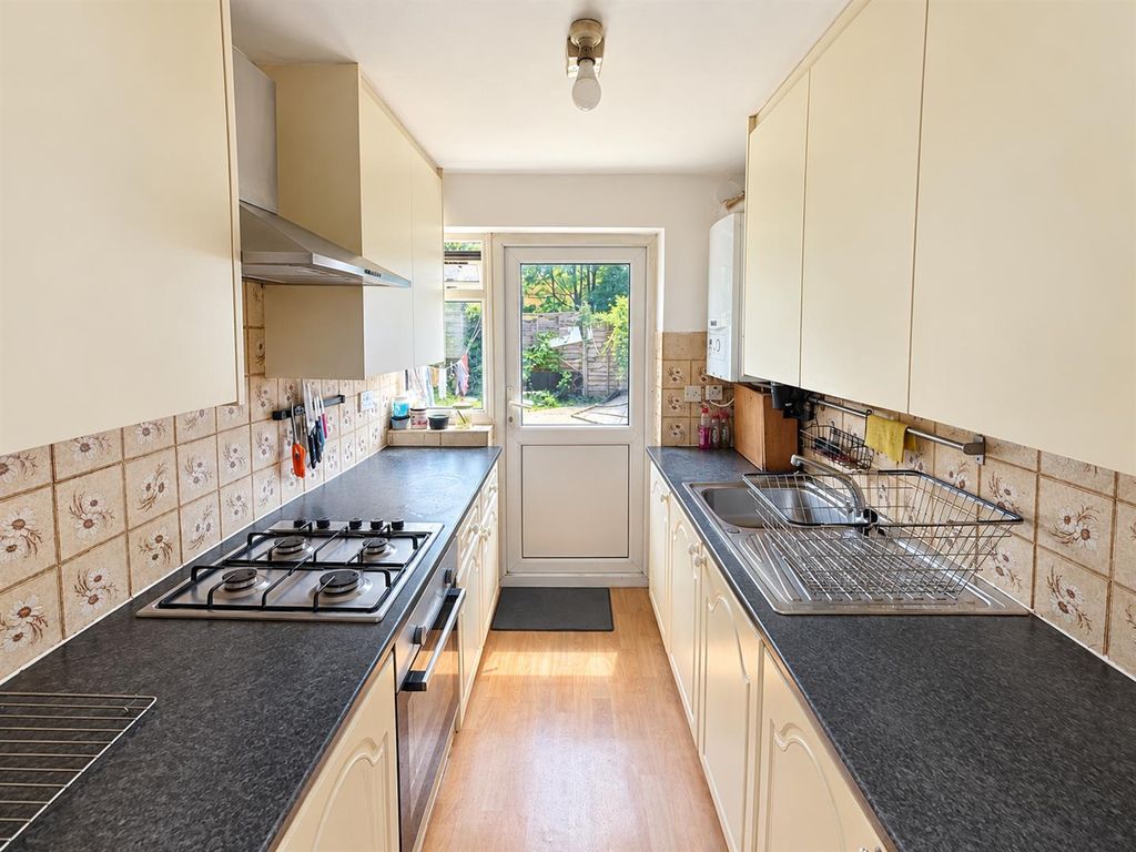 Property photo 3 of 8 Bright Galley Kitchen With Garden View.Png