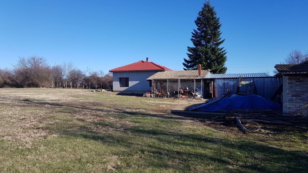 Property photo 3 of 93 View Of A House With A Red Roof And An Attached Covered Area, Surrounded By Open Land And Trees In The Background.