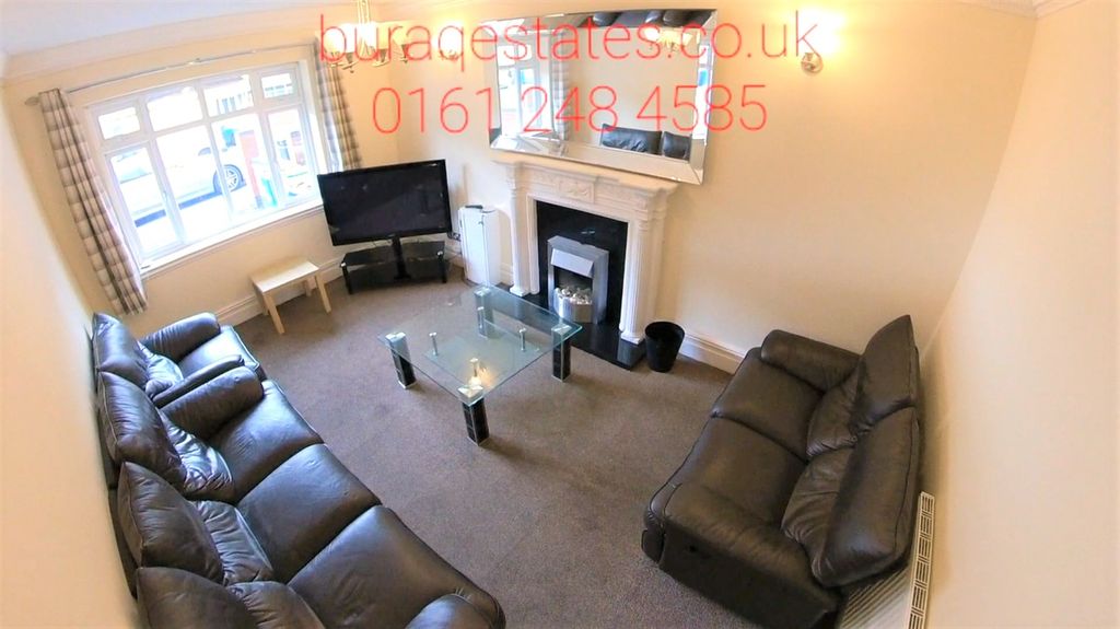 Property photo 1 of 15 Bright And Welcoming Living Room Featuring Comfort...