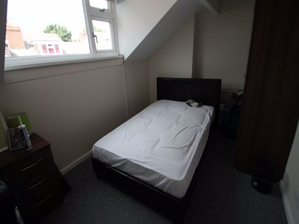 Property photo 2 of 4 A Neatly Made Master Bedroom With A Comfortable Do...