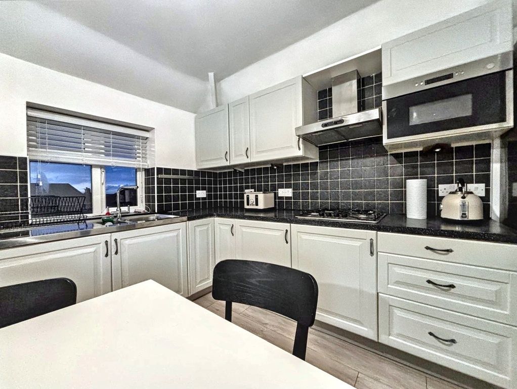 Property photo 3 of 7 Bright, Modern Fitted Kitchen With White Cabinetry...