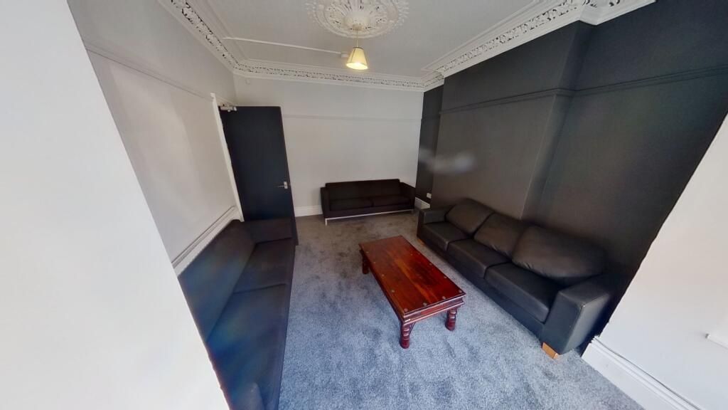 Property photo 2 of 11 A Contemporary Living Room Featuring Two Large Bla...