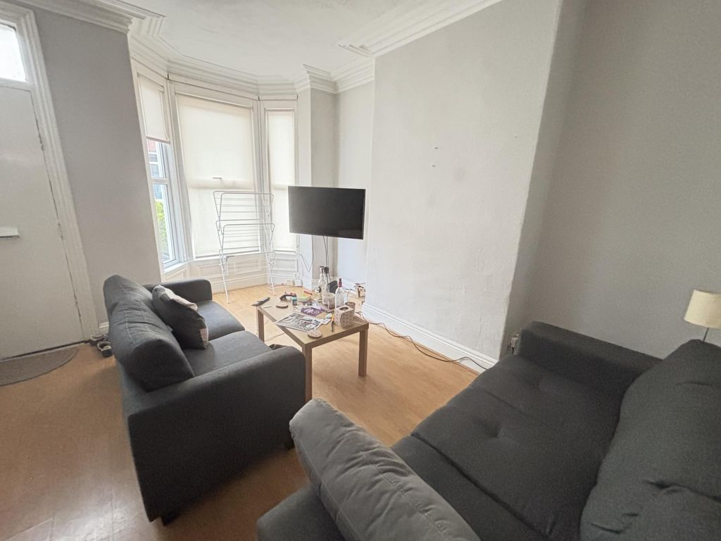 Property photo 1 of 13 A Bright And Welcoming Living Room Featuring Two c...