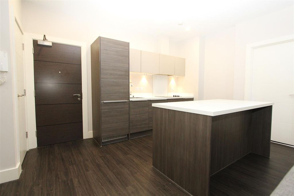 Property photo 3 of 11 Modern Kitchen With Sleek Breakfast Island And Woo...