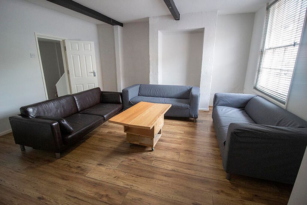 Property photo 1 of 5 Spacious Living Room Featuring Comfortable Seating...