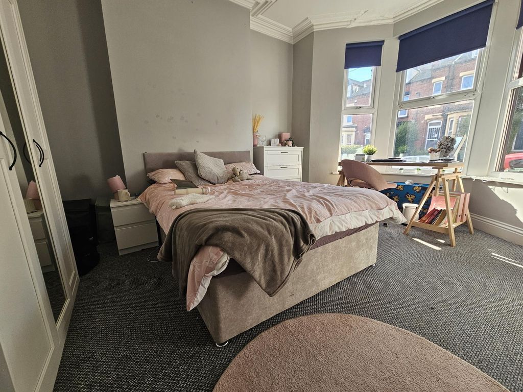 Property photo 3 of 19 A Cozy And Stylish Master Bedroom Featuring A Comf...