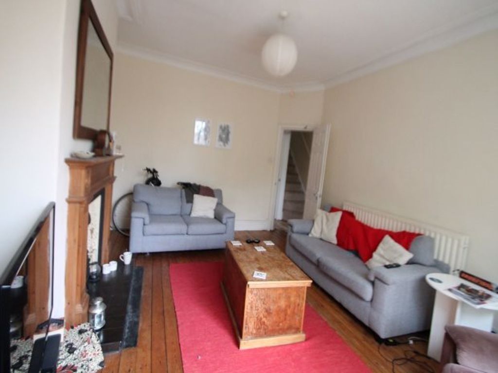 Property photo 2 of 17 A Spacious And Inviting Living Room Featuring Two ...