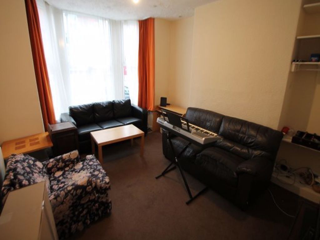 Property photo 1 of 12 A Well-Lit Living Room Featuring Comfortable Seati...