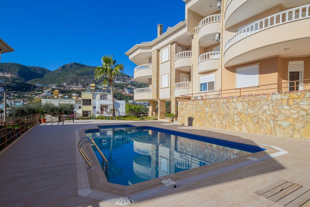 Property photo 1 of 25 Exceptional Alanya Property For Sale In Tepe - Main View Of The Shared Pool And Terraces