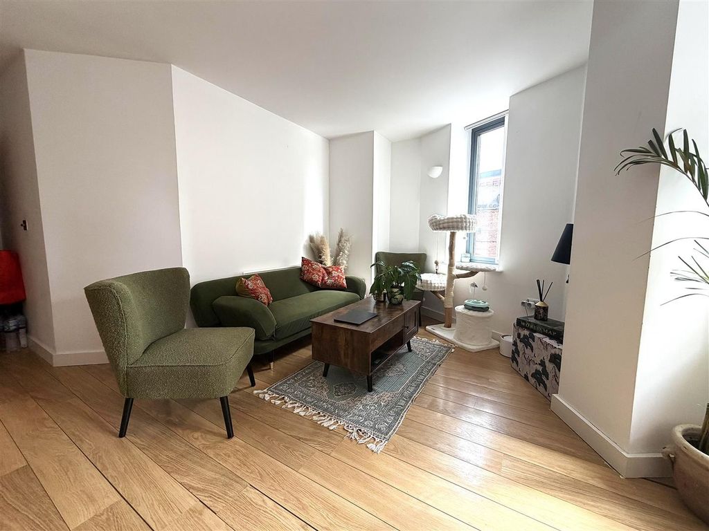 Property photo 2 of 10 Stylish Lounge With Sleek Wooden Flooring...