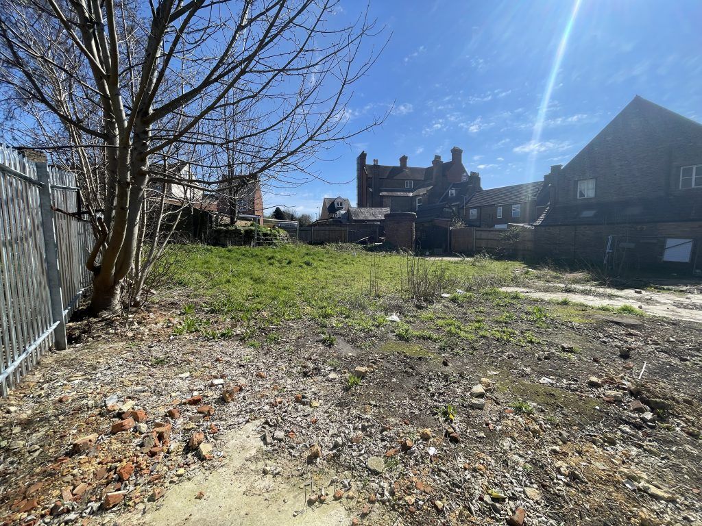 Property photo 2 of 2 An Open Yard With Metal Fencing Around It.