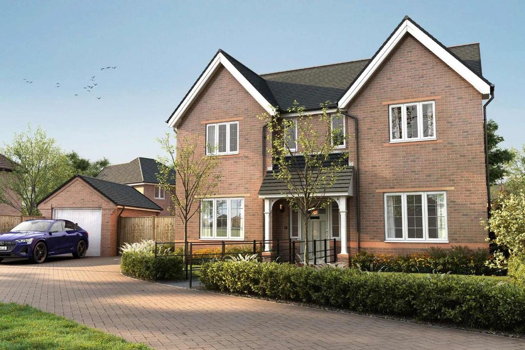 Property photo 1 of 10 A Two-Story Brick House With A Garage, Surrounded By Landscaped Gardens And A Paved Driveway