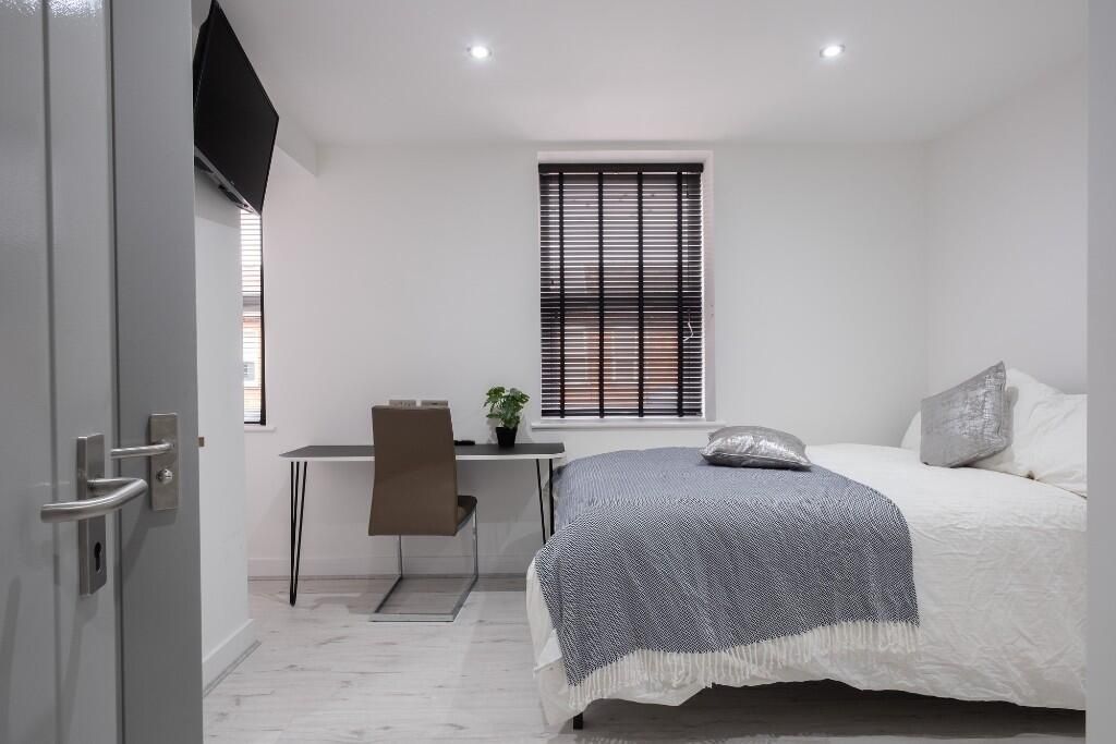 Property photo 3 of 13 A Bright And Tidy Bedroom Featuring A Comfortable ...