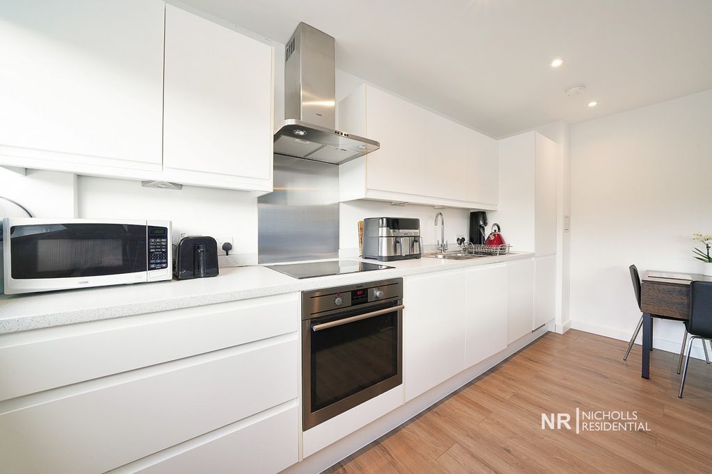 Property photo 3 of 12 Kitchen Area