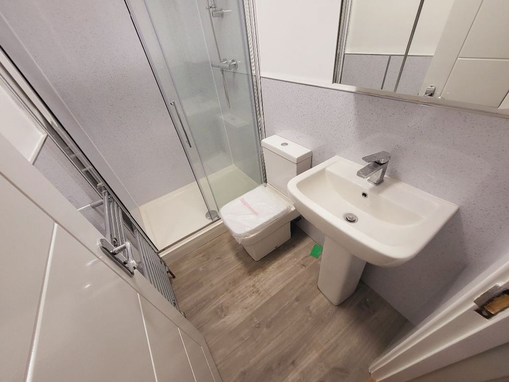 Property photo 2 of 15 A Modern Bathroom Featuring A Sleek Shower, Contem...