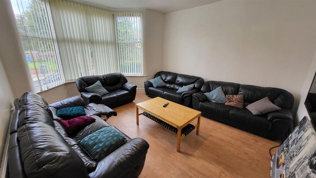 Property photo 1 of 14 Bright And Comfortable Living Room Featuring Ample...