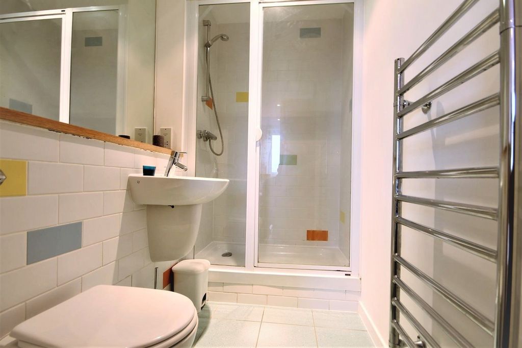Property photo 2 of 15 Bright And Modern Bathroom Suite Featuring A Spaci...