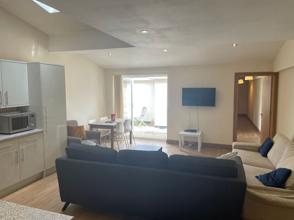 Property photo 2 of 4 Bright And Spacious Living Area Featuring Modern F...