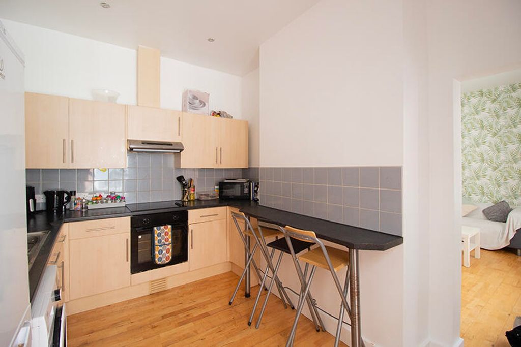 Property photo 2 of 4 This Stylish Kitchen Features Modern Appliances An...