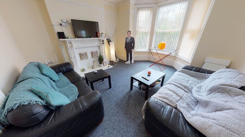 Property photo 2 of 7 A Cozy And Inviting Living Room Featuring Two Comf...